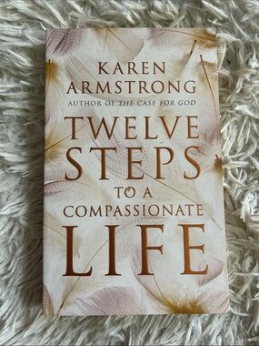 Twelve (12) steps to a compassionate life, by Karen Armstrong, paperback